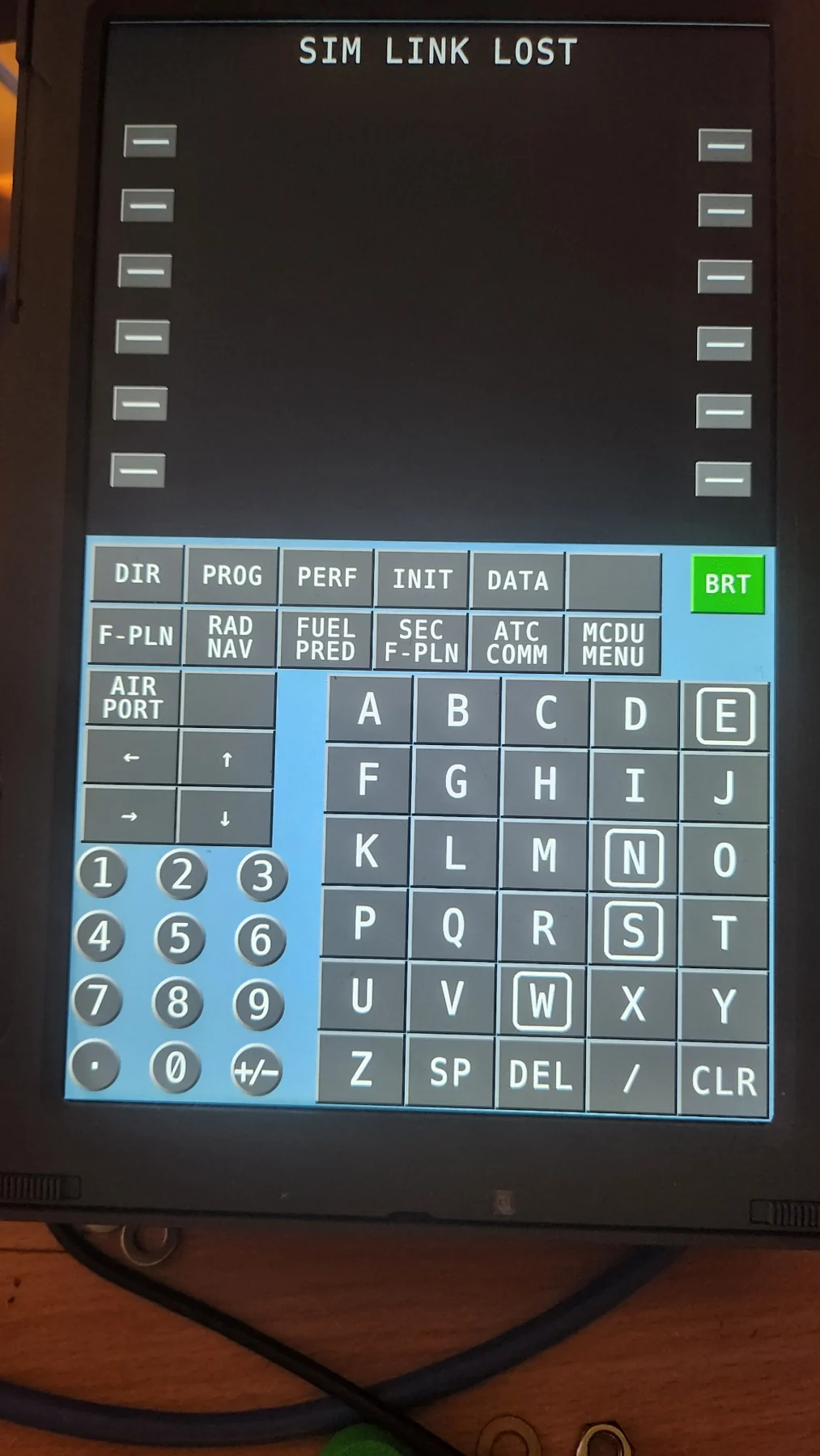 Early Airbus touchscreen interface with blue keypad background and smaller arrow symbols