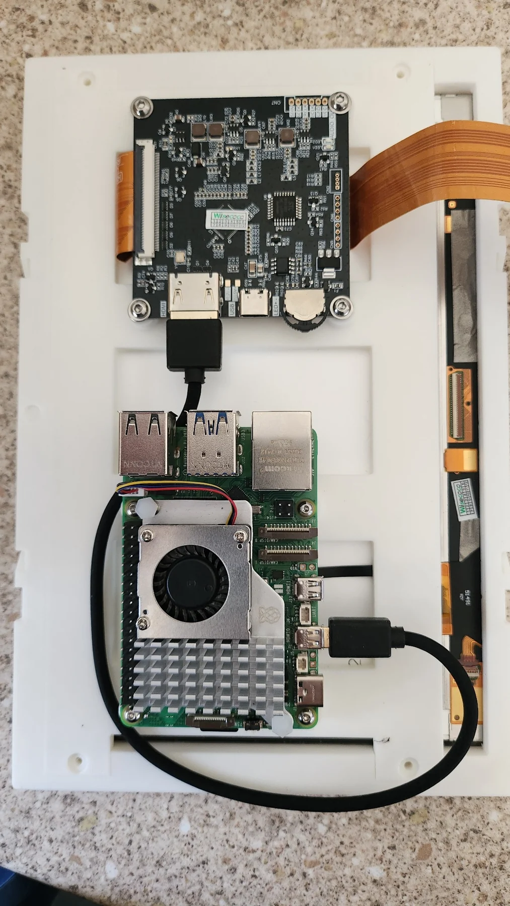 Early TFMC internal assembly with Raspberry Pi 5, cooling fan and display controller on printed structure